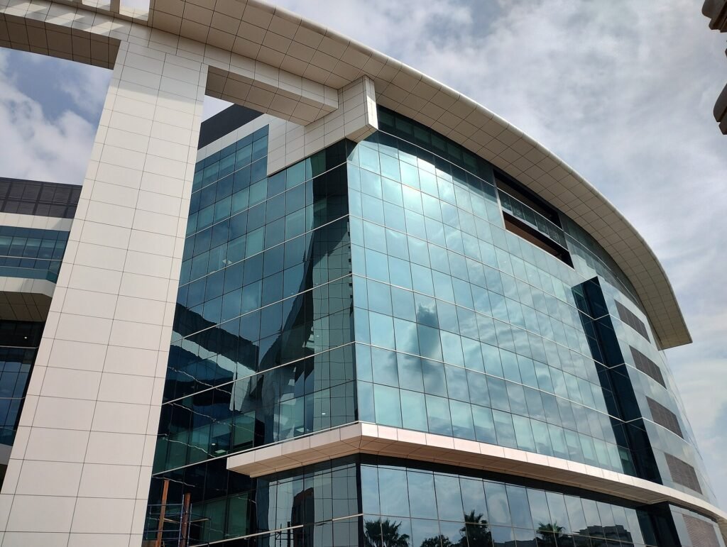 A curved glass office building at Bagmane Tech Park in Bengaluru