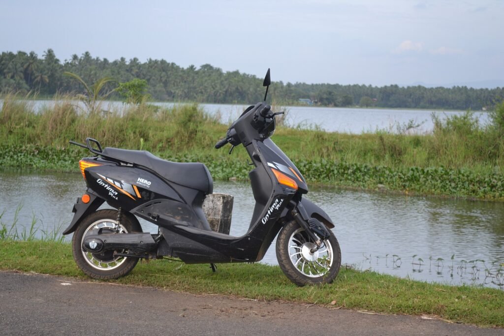 A Hero Electric Optima Plus electric scooter parked on a street in India