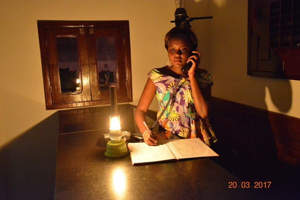 A hotel receptionist working at a front desk