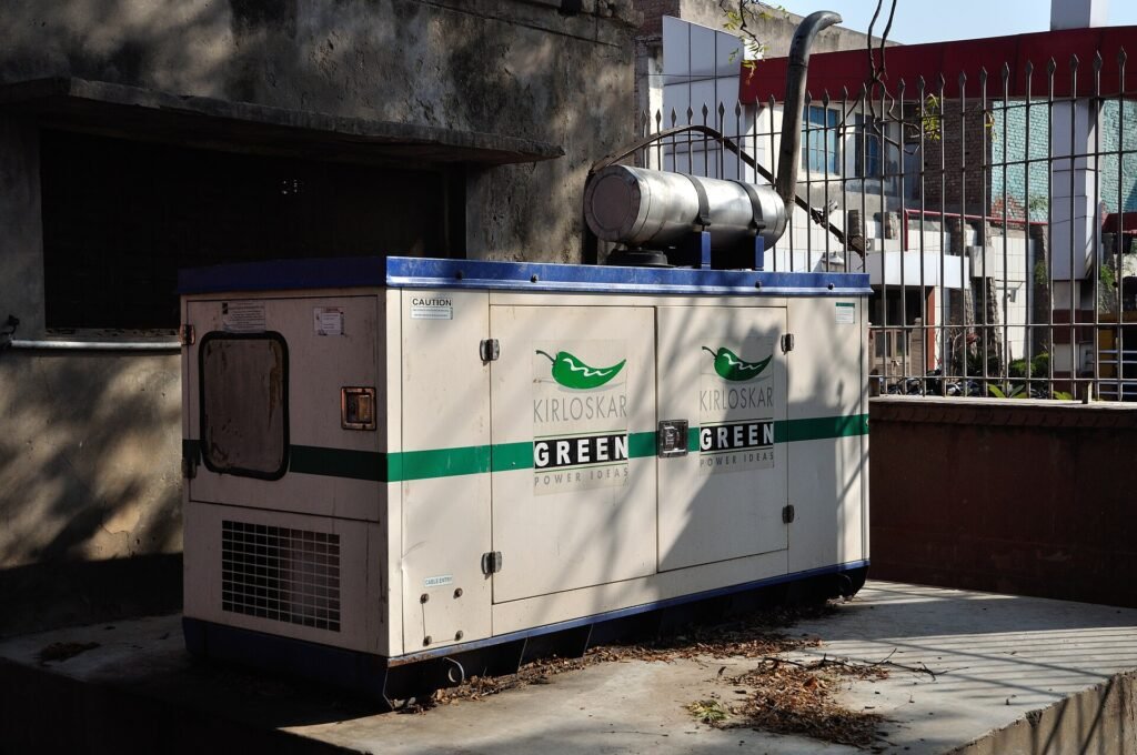 A large enclosed diesel generator set installed outdoors in Mathura, India