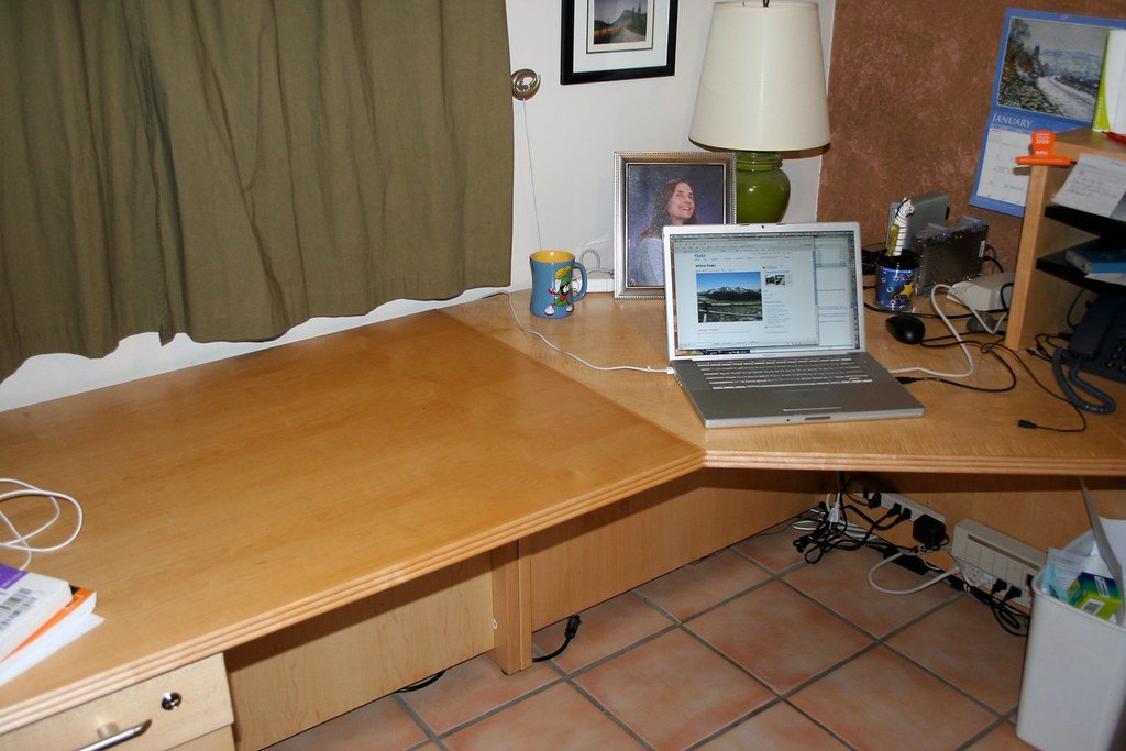 A single open laptop on an office desk