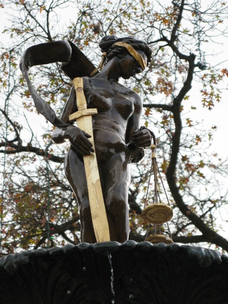 A small brass scales of justice ornament