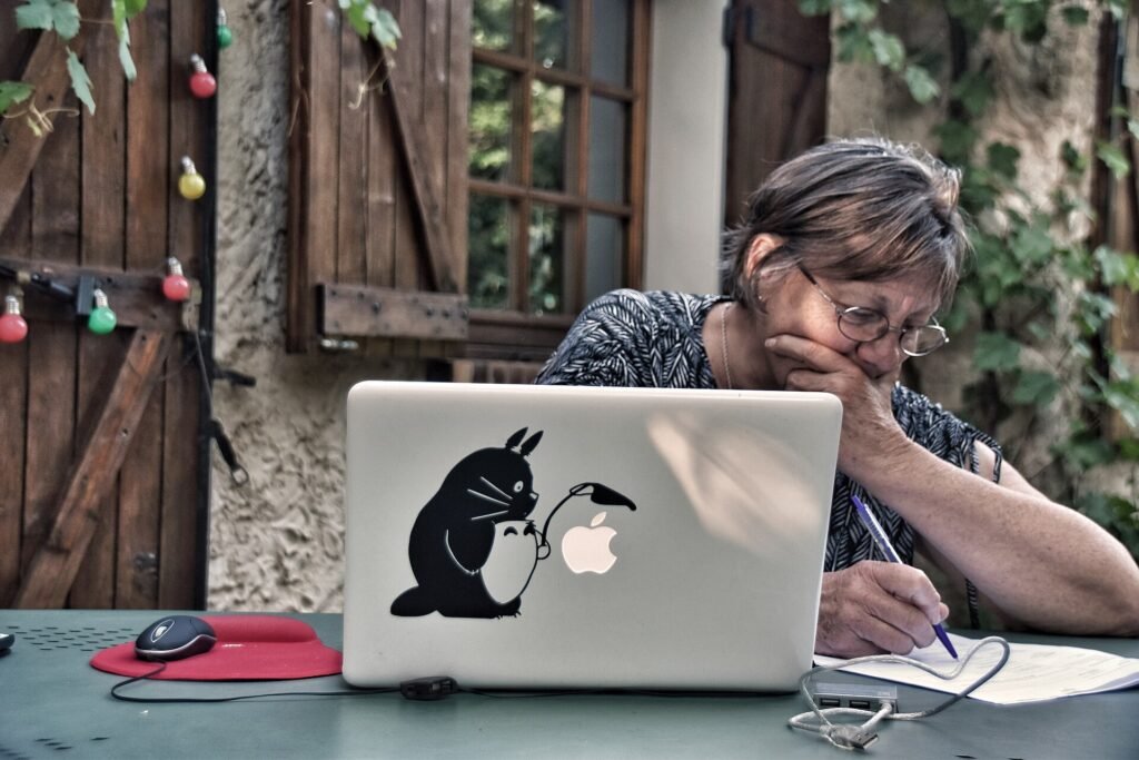 An author proofreading a printed manuscript by hand at home