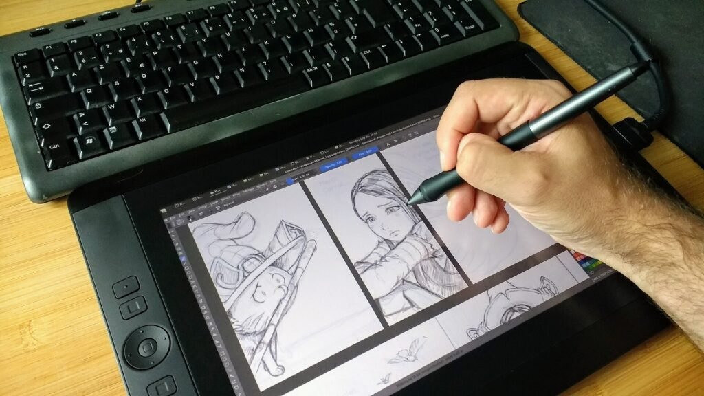 An illustrator pencilling a comic page on a Wacom Cintiq 13HD pen display