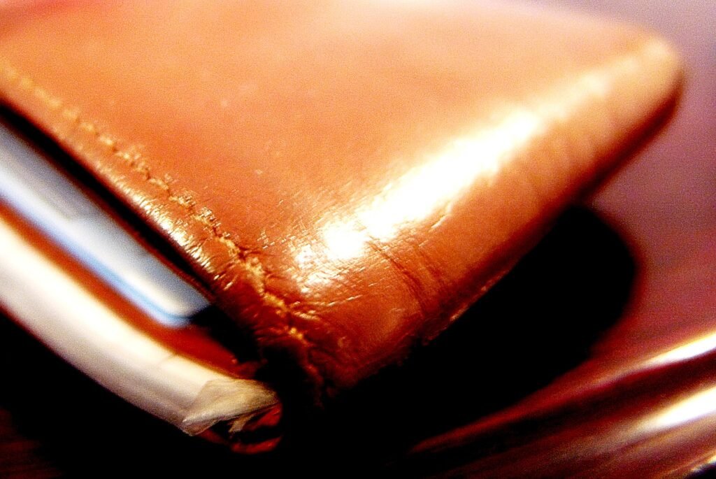 An open wallet packed with bank, ID and access cards