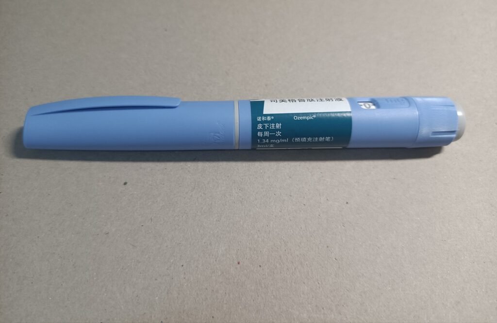 An Ozempic semaglutide injection pen on a table