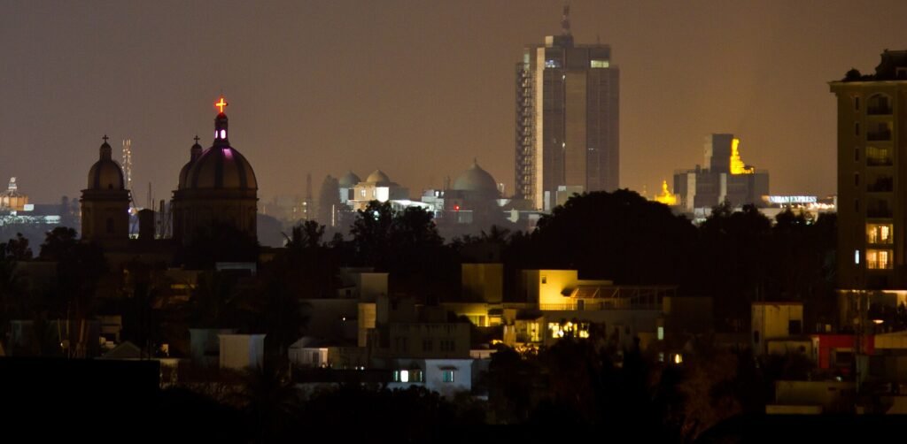Bengaluru city skyline with office towers and trees in the foreground