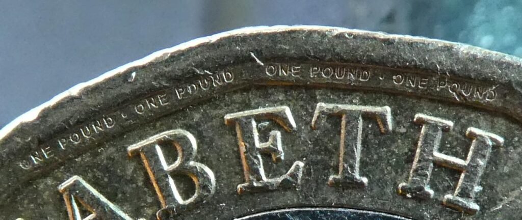 Both sides of a British one pound coin