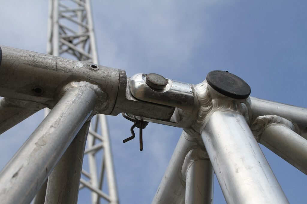 Close-up of a pinned connection joining two aluminium event truss sections