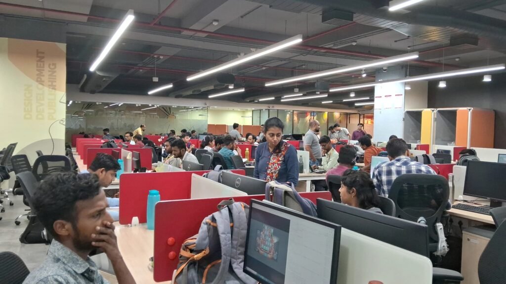 Developers working at computer desks in a game development office in India