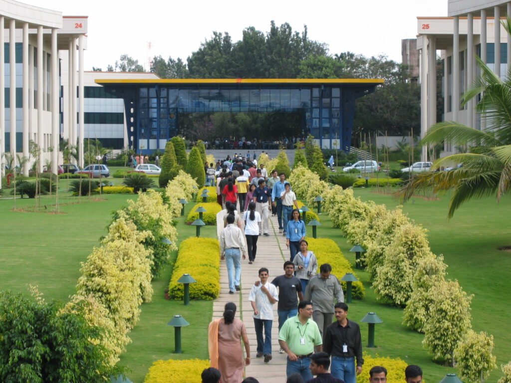 Employees walking across the Infosys campus in Electronic City, Bengaluru, at lunchtime