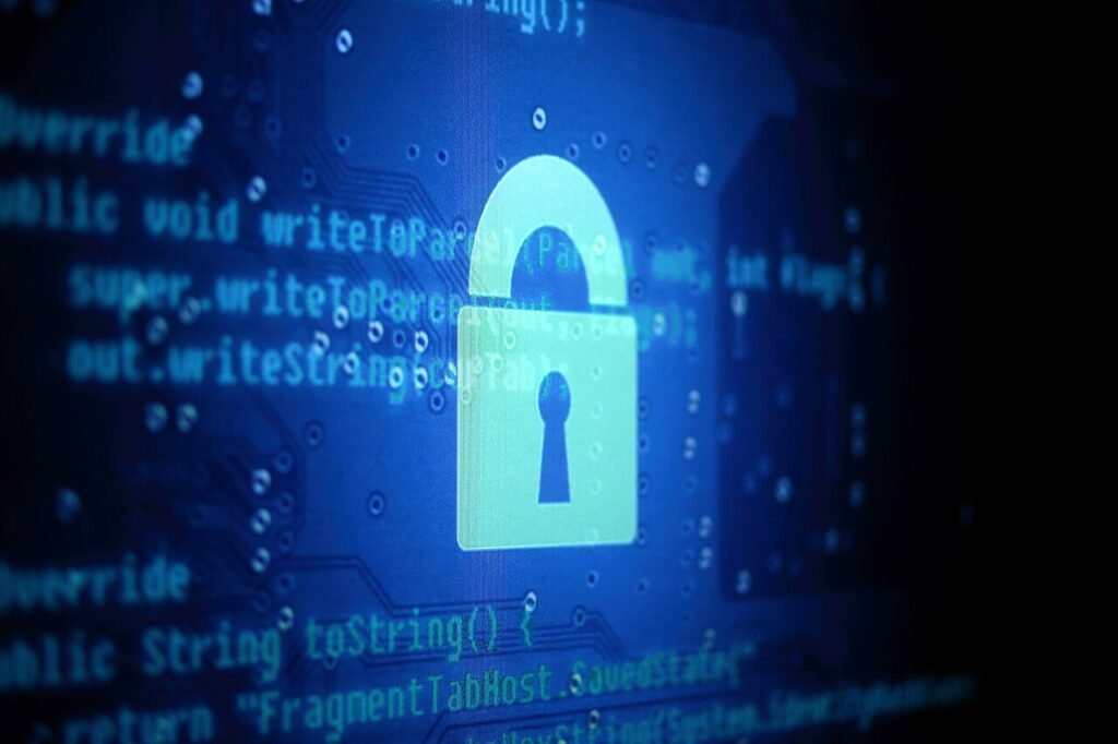 Glowing padlock icon over lines of program code on a blue circuit-style background