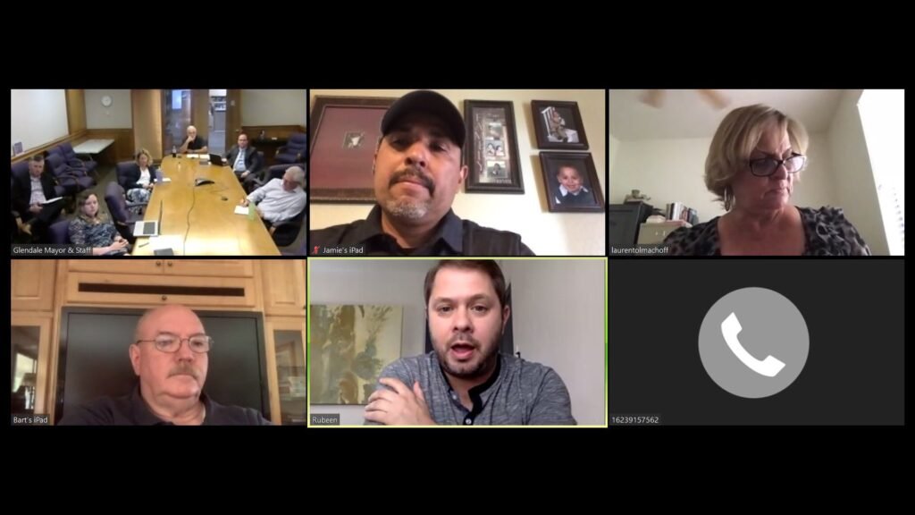 Grid of participants in a Zoom video call between a US congressman and city officials