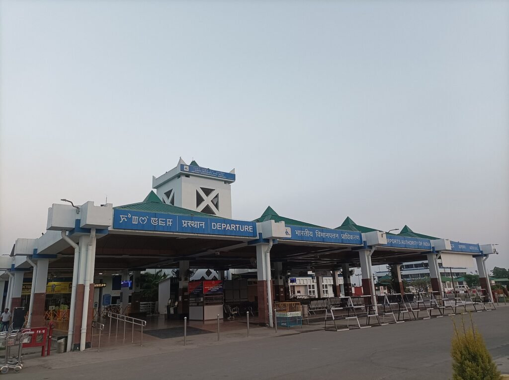 Imphal International Airport signage showing the airport's name in the Meitei language