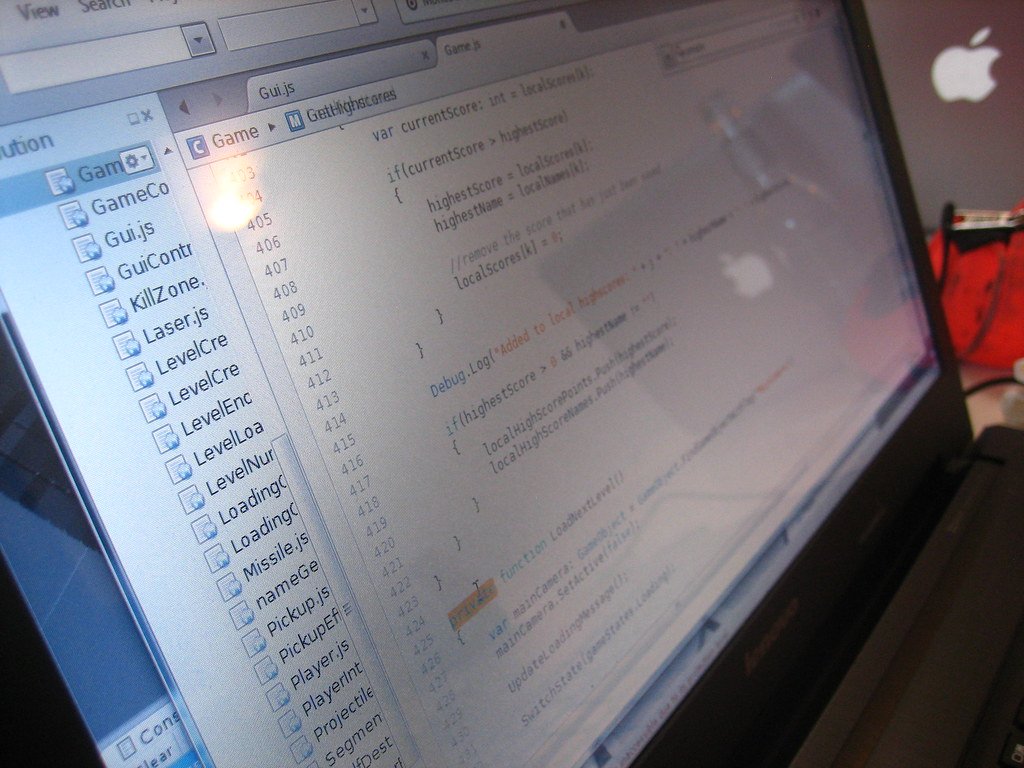 Java source code displayed on a laptop screen