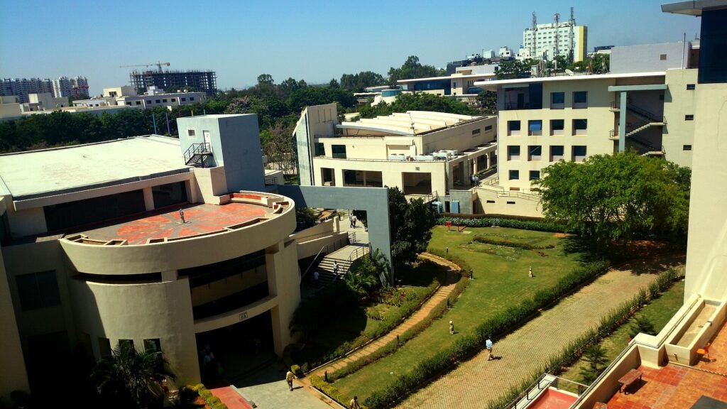 Low-rise buildings and landscaped lawns on the Wipro campus in Electronic City, Bengaluru