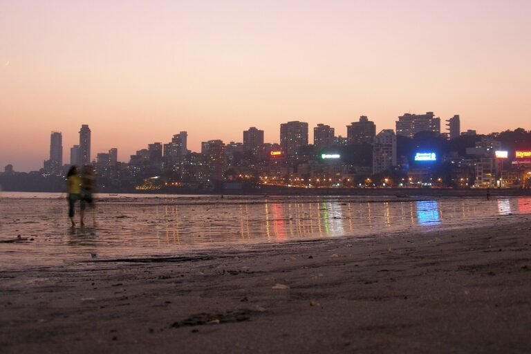 Mumbai skyline at night with lit high-rise towers along the waterfront