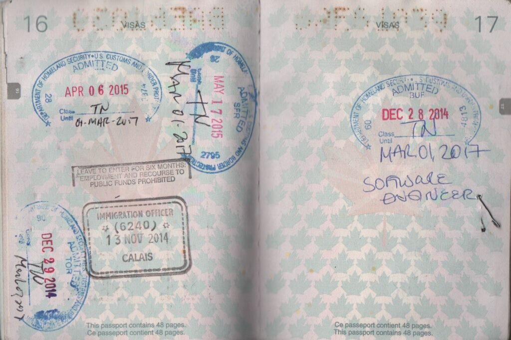 Open Canadian passport pages showing US and UK entry stamps