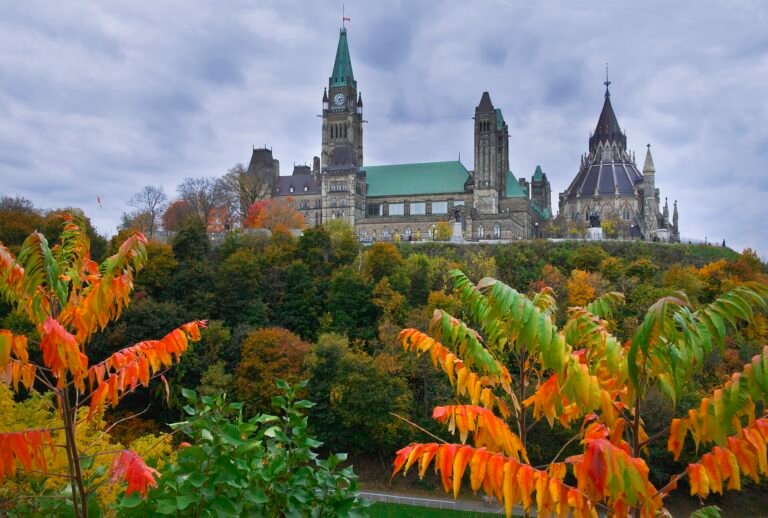 Parliament Hill in Ottawa with the Peace Tower and Centre Block above the Ottawa River