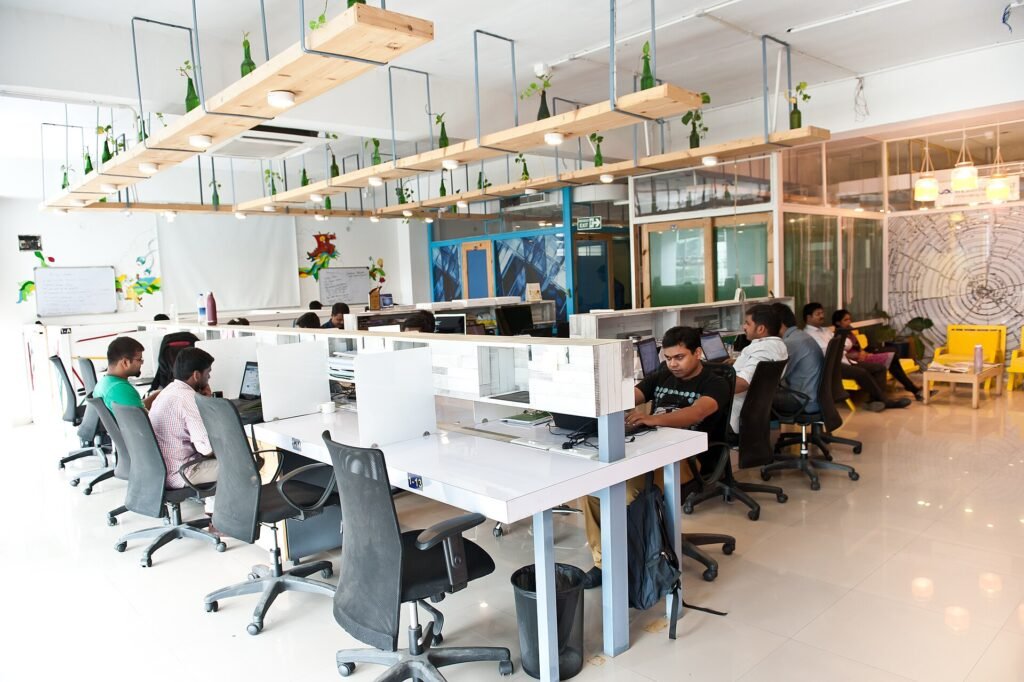 People working at desks in a shared office space in HSR Layout, Bengaluru