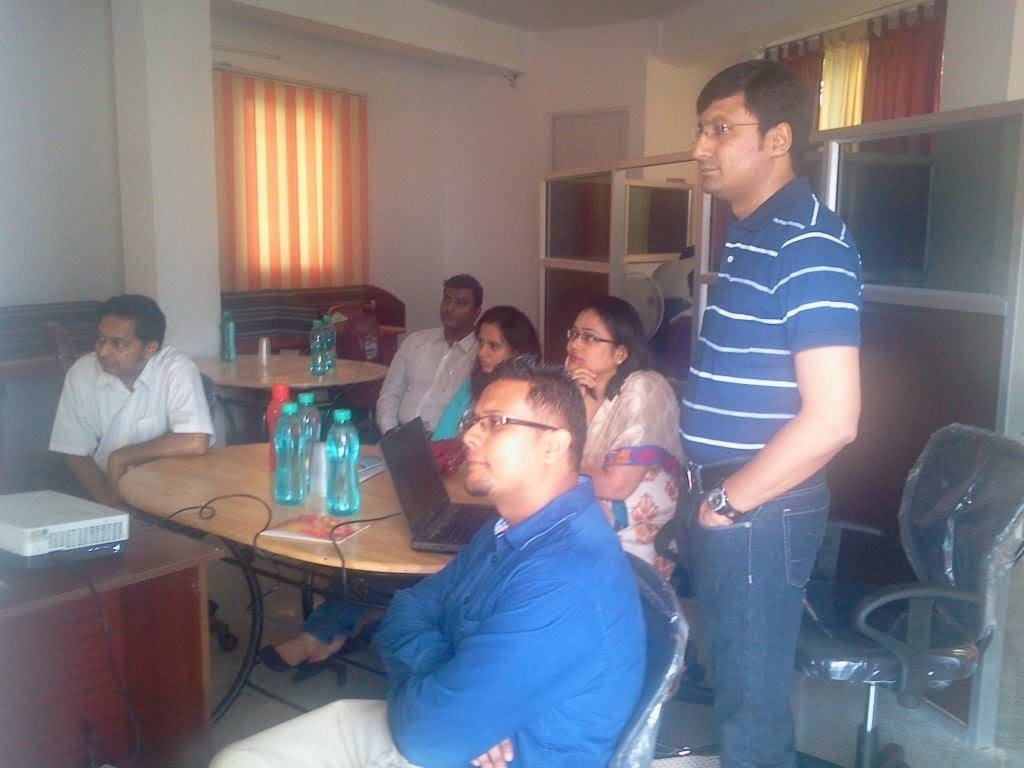 People working on laptops at a coworking hub in Bangalore