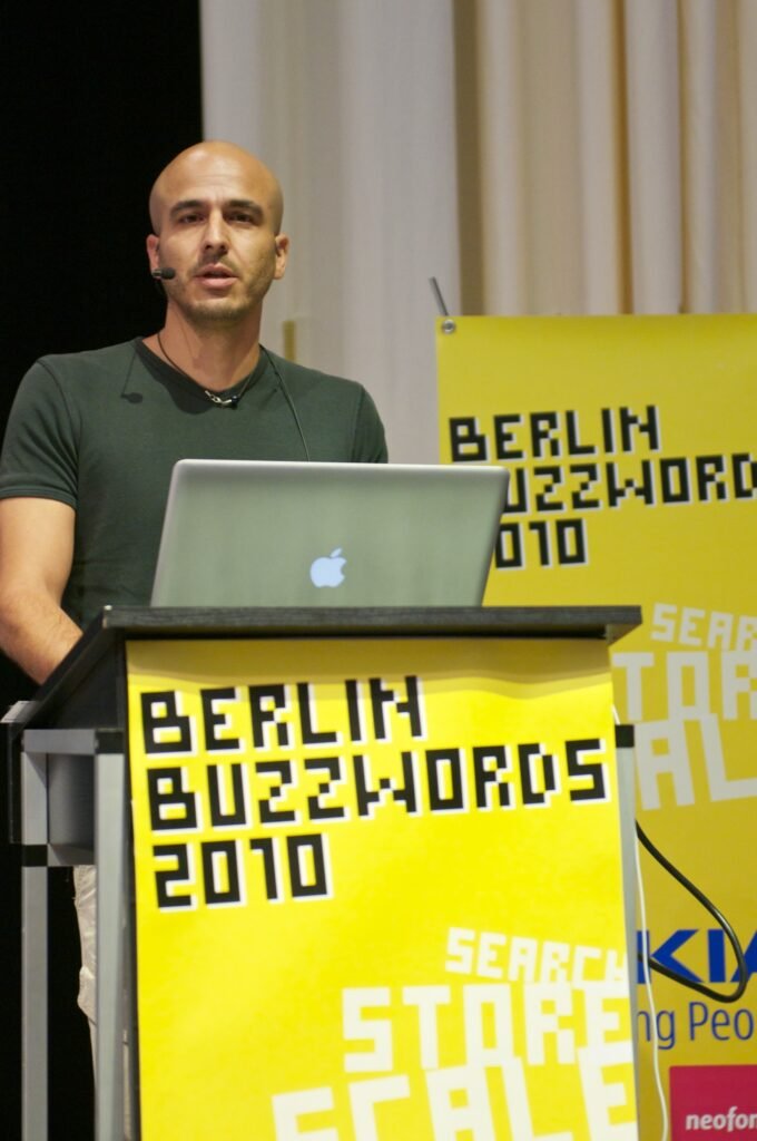 Shay Banon standing at a lectern presenting Elasticsearch at the Berlin Buzzwords conference in 2010