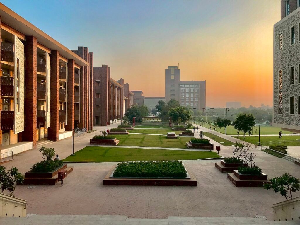 Students walking across a landscaped university campus in India