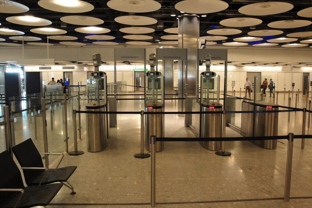 Travellers using ePassport gates in the arrivals hall at Heathrow Terminal 5